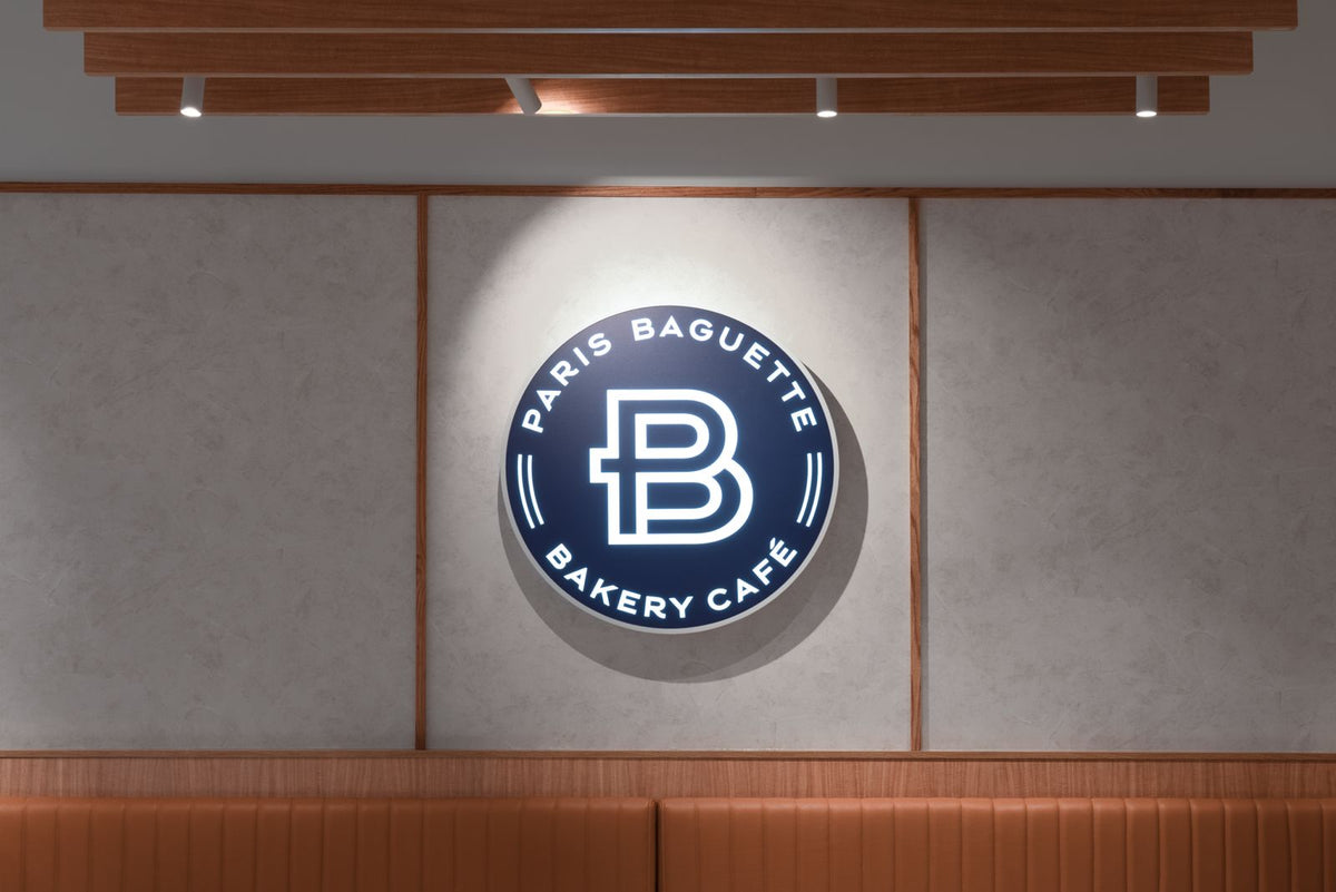 Paris Baguette interior feature wall with backlit logo
